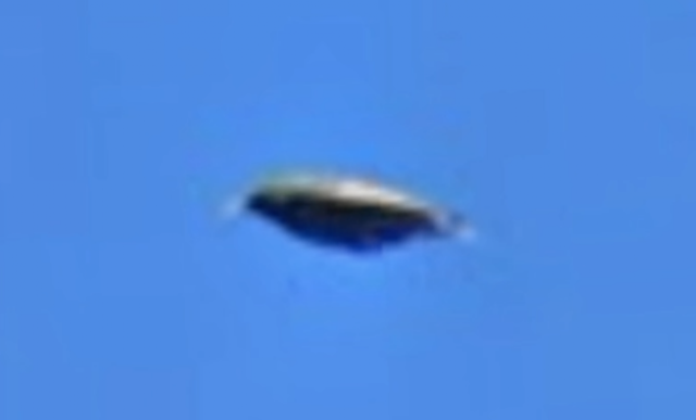 Source-provided UFO Sightings Daily screenshot of a claimed disk-like object in a Google Earth mapping-car image from Canada