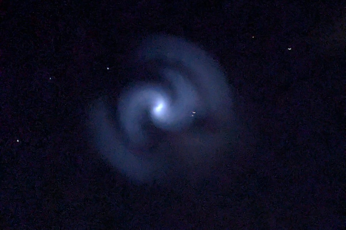 Source image from BBC Sky at Night showing a spiral-like sky event.