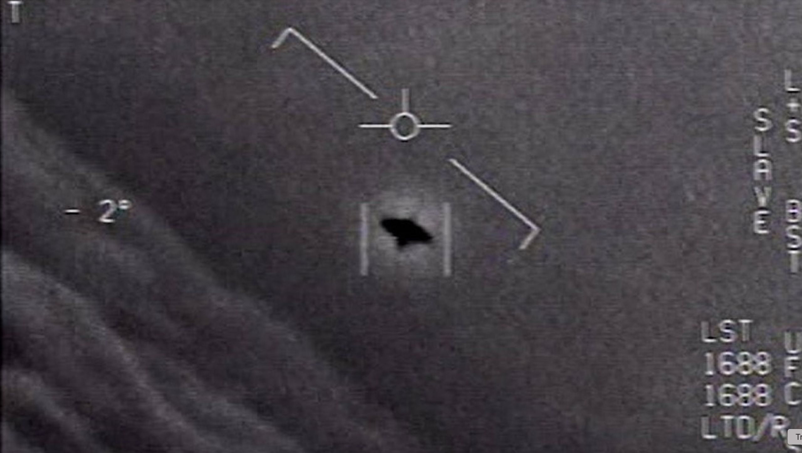 Space.com source image from Pentagon/UAP-release coverage showing a Navy-pilot-style UAP frame; source media, not independent verification by The UAP Trail.